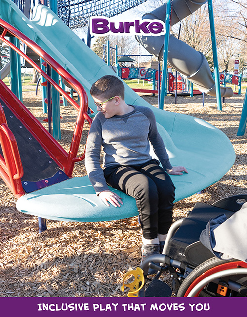 Child sliding on inclusive Burke playground equipment