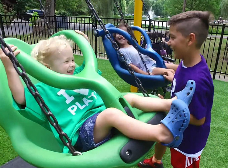 Children enjoying the BCI burke swing