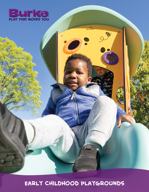 Young child playing on Burke playground equipment 